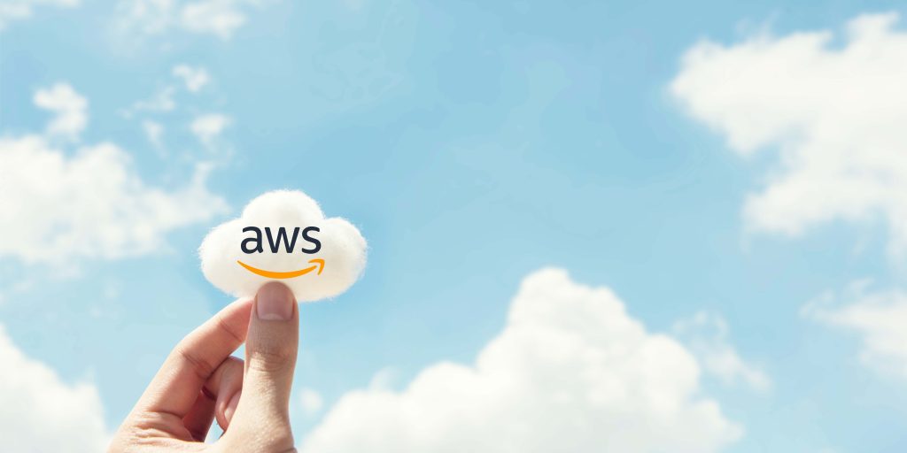 Human holding AWS Cloud in hand